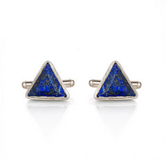 Pair of triangle-shaped cufflinks with blue stone centers on a white background