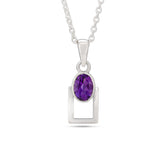 Silver pendant with a purple gemstone on a white background