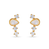 Gold earrings with clear gemstones on a white background