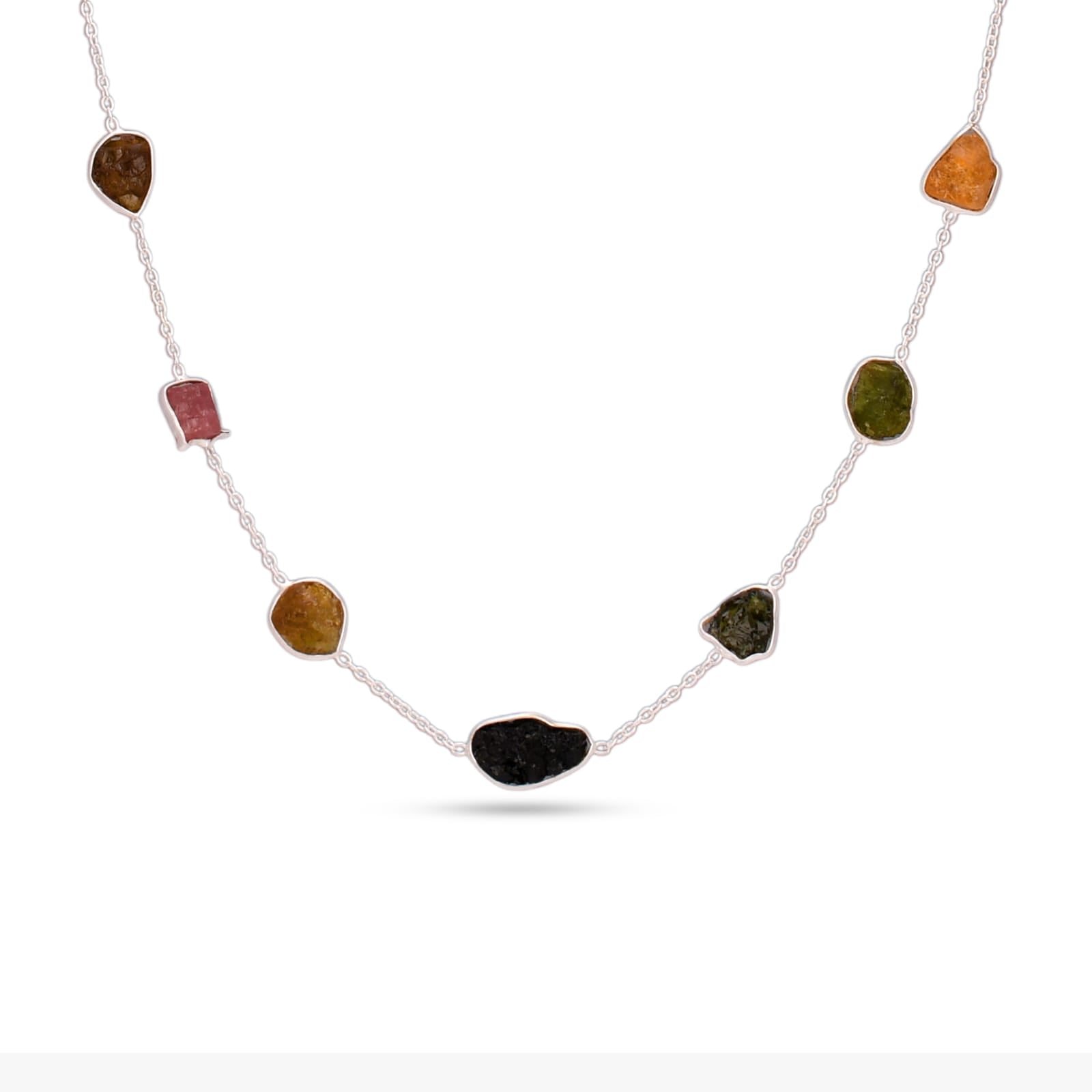 Necklace with multicolored stones on a white background