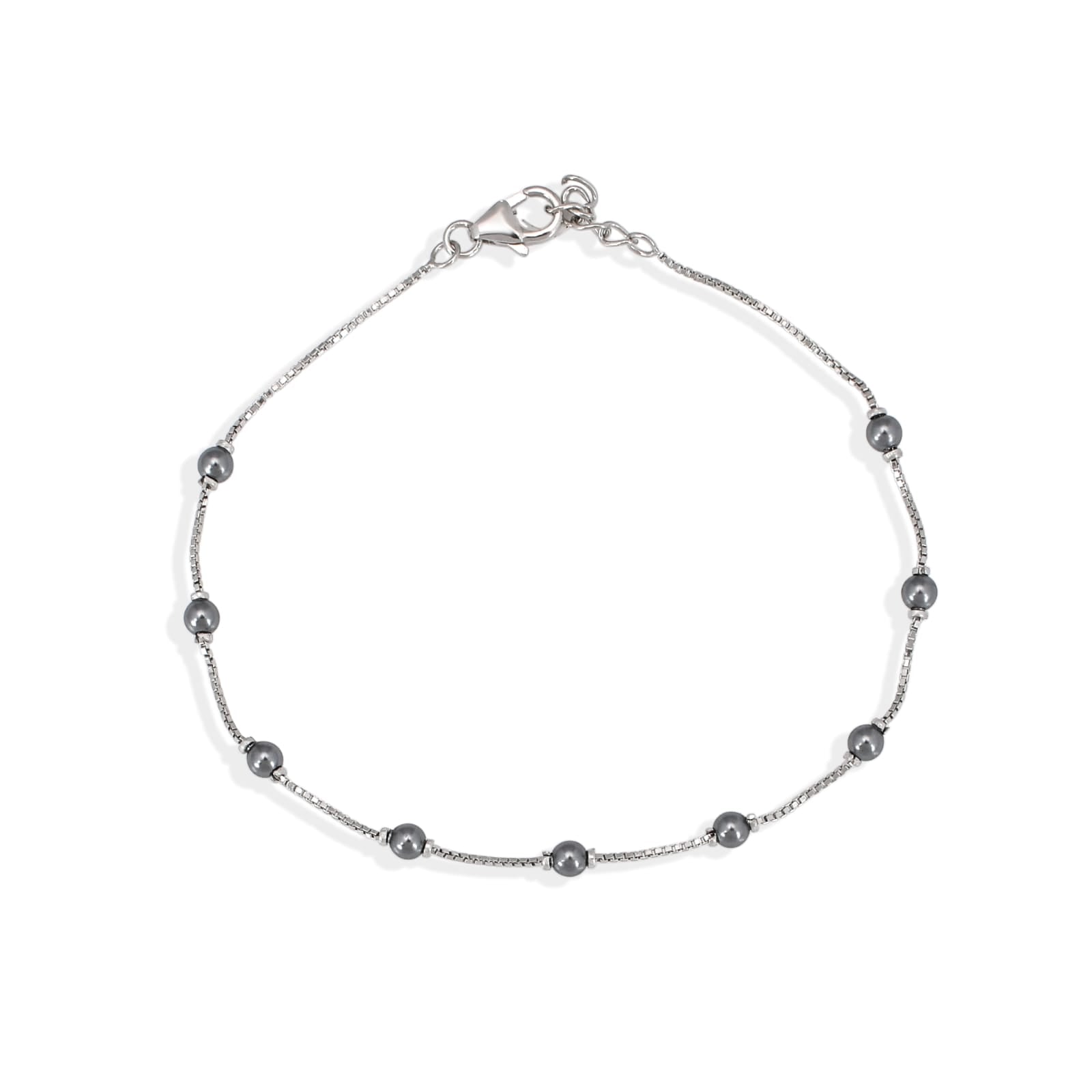Silver bracelet with small beads on a white background