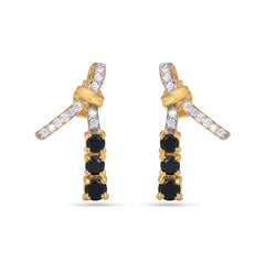 Gold earrings with black gemstones and clear stones on a white background