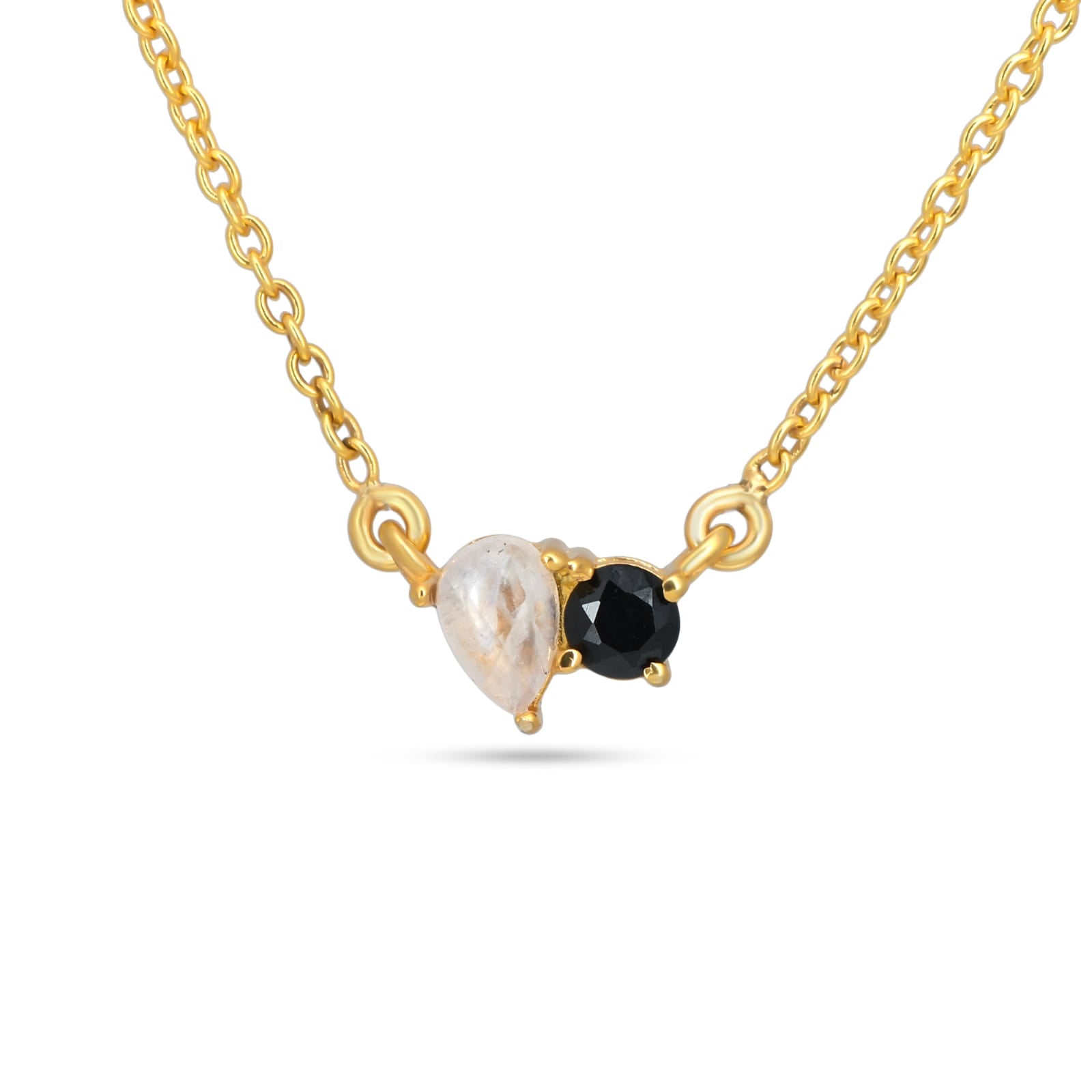 Gold necklace with a black gemstone and a pearl on a white background