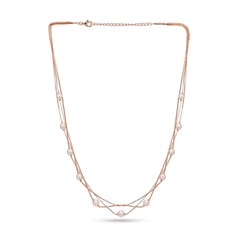 Rose gold necklace with pearls on a white background