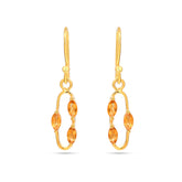 Gold earrings with orange gemstones on a white background