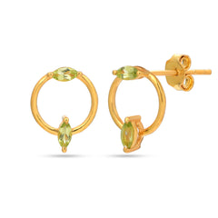 Gold hoop earrings with green gemstones on a white background