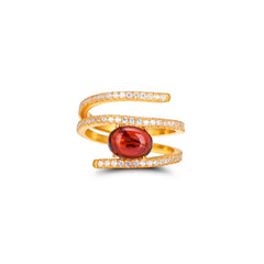 Gold ring with a red gemstone and small diamonds on a white background