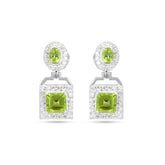 Pair of earrings with green gemstones on a white background