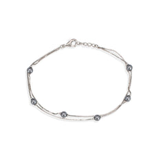 Silver bracelet with pearls on a white background