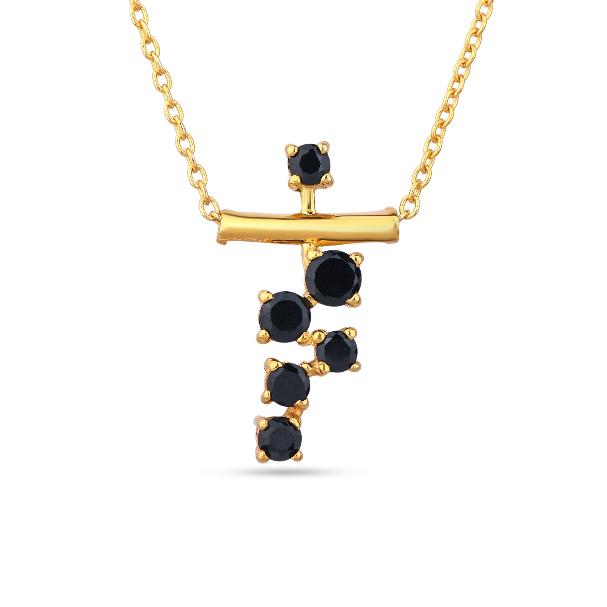 Gold necklace with black gemstones on a white background