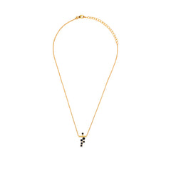 Gold necklace with a small pendant on a white background