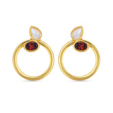 Gold hoop earrings with red gemstones and white stones on a white background