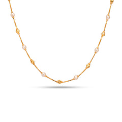 Gold necklace with pearls on a white background