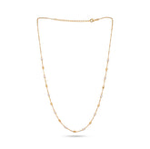 Gold necklace with small pearls on a white background