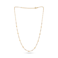 Gold necklace with small pearls on a white background