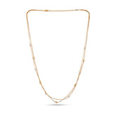 Gold necklace with small pearls on a white background