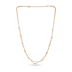 Gold necklace with small pearls on a white background