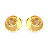 Gold earrings with citrine stones on a white background