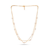 Gold necklace with pearls on a white background
