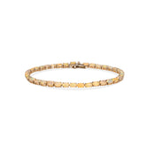 Gold bracelet on a white background