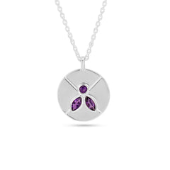 Silver necklace with a round pendant featuring purple gemstones on a white background