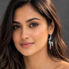 Woman wearing earrings with a neutral background