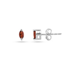 Pair of silver earrings with red gemstones on a white background