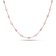 Pearl necklace with pink beads on a white background