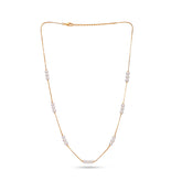 Gold necklace with pearls on a white background