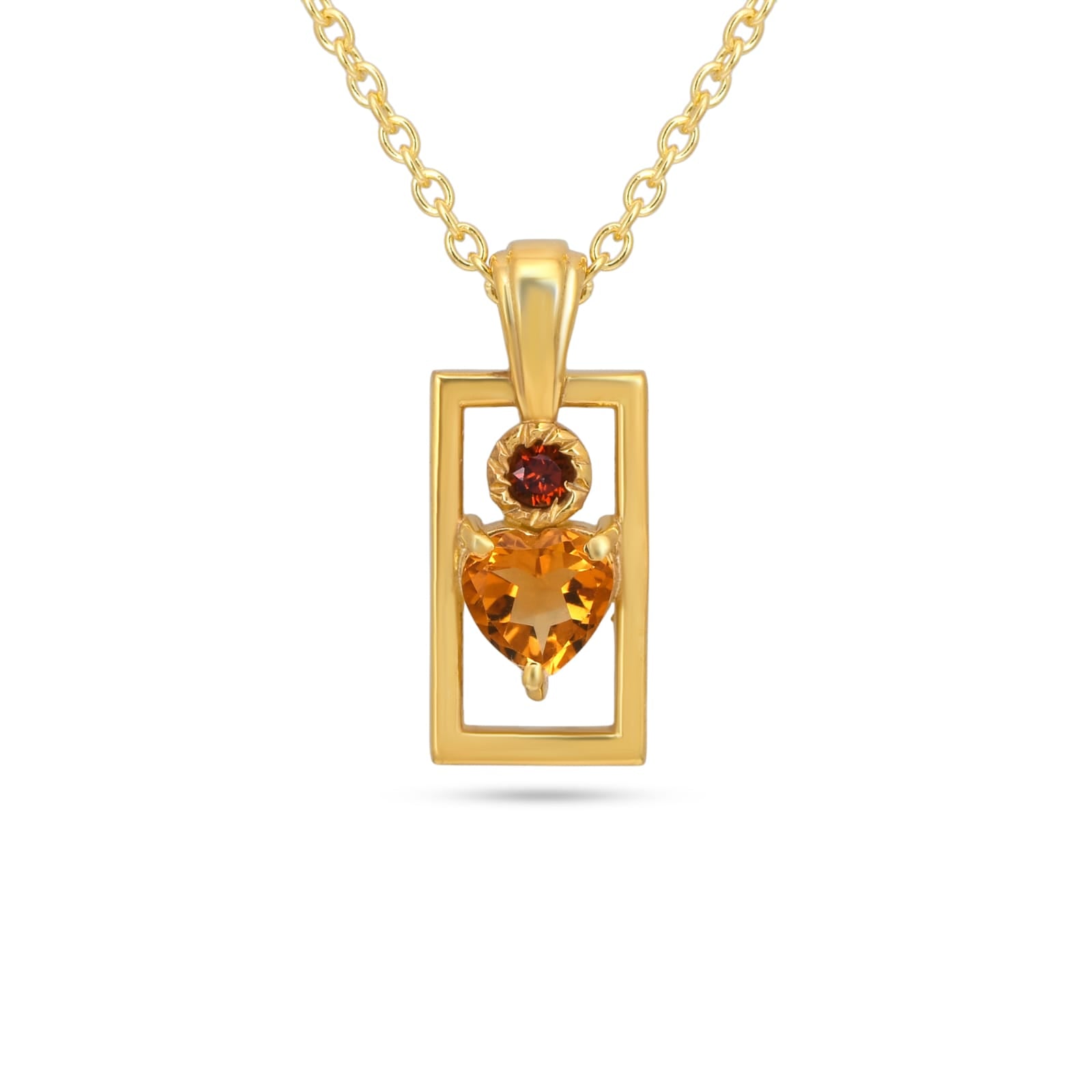 Gold pendant with heart-shaped gemstone on a white background