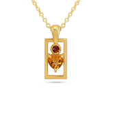 Gold pendant with heart-shaped gemstone on a white background