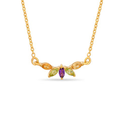 Gold necklace with gemstones on a white background