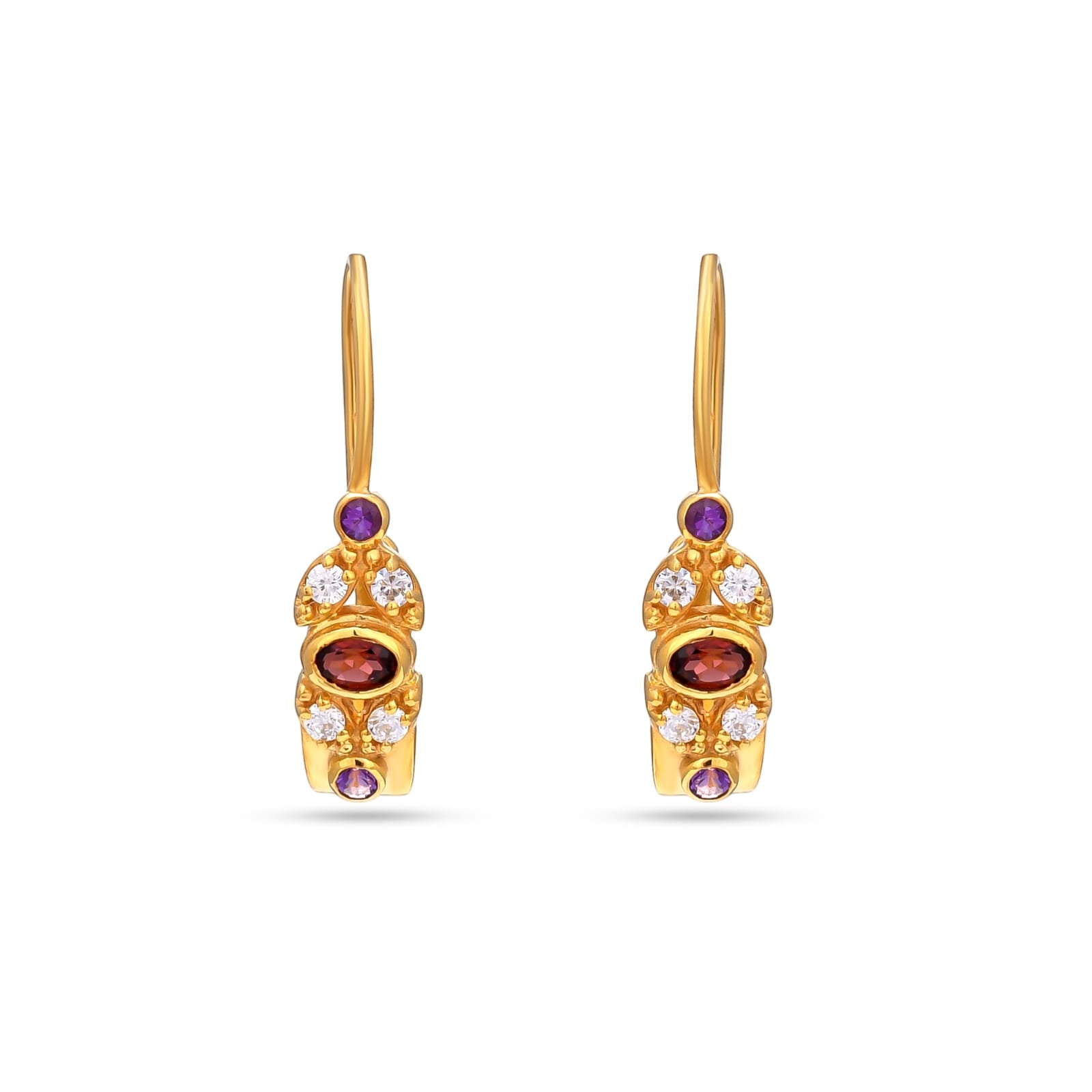 Gold earrings with gemstones on a white background