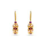 Gold earrings with gemstones on a white background