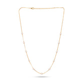 Gold necklace with pearls on a white background