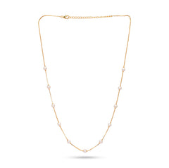 Gold necklace with pearls on a white background