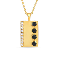 Gold pendant with black stones and diamonds on a white background
