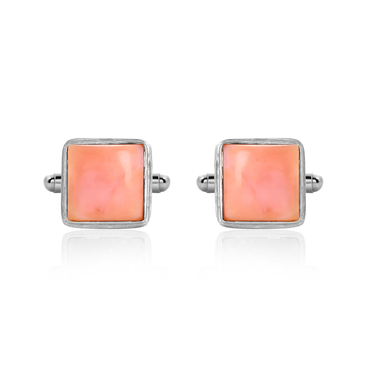 Pair of square pink cufflinks with silver borders on a white background