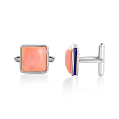 Cufflinks with coral-colored square stones and silver accents on a white background