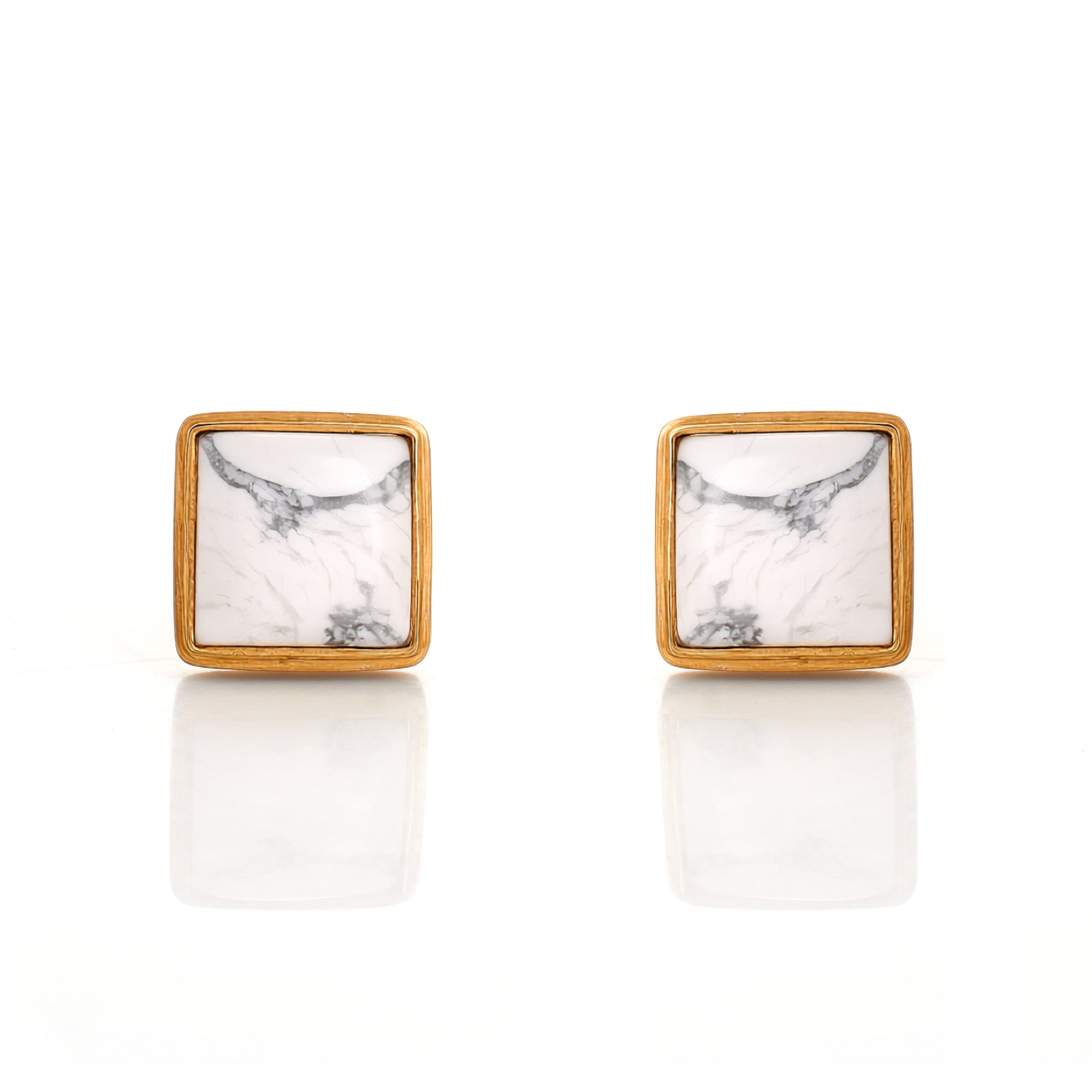 Square stud earrings with marble pattern and gold frame on a white background