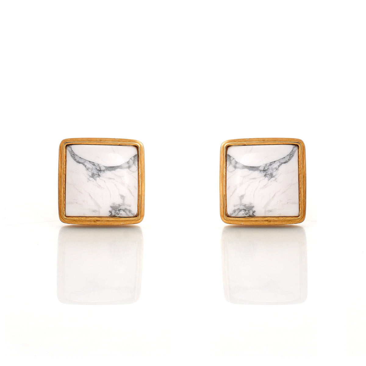 Square stud earrings with marble pattern and gold frame on a white background