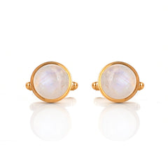 Pair of gold earrings with round moonstone stones on a white background