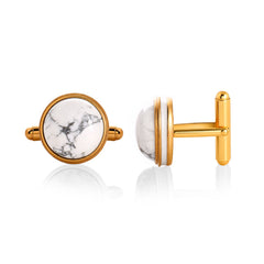 Gold cufflinks with white marble design on a white background