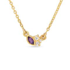 Gold necklace with a purple gemstone and small diamonds on a white background