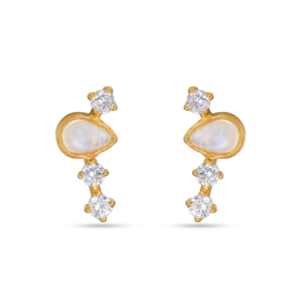 Gold earrings with clear gemstones on a white background