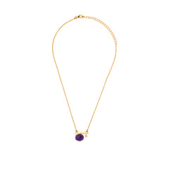Gold necklace with a purple gemstone on a white background