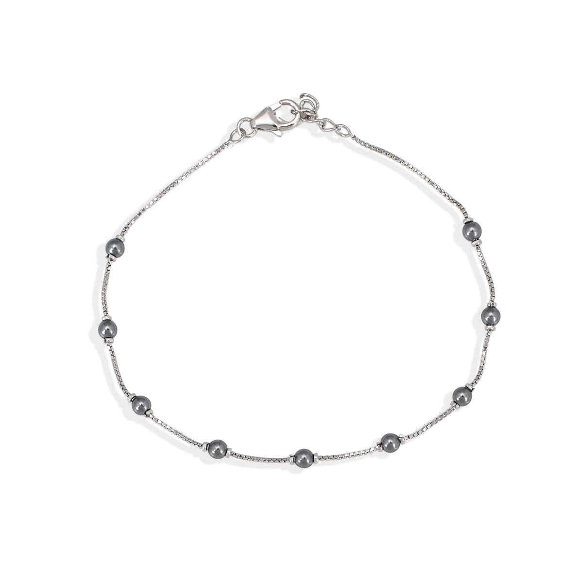 Silver bracelet with small beads on a white background