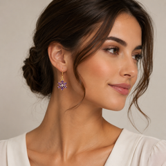 Woman wearing a pair of earrings with a neutral background