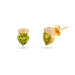 Gold earrings with green gemstones on a white background