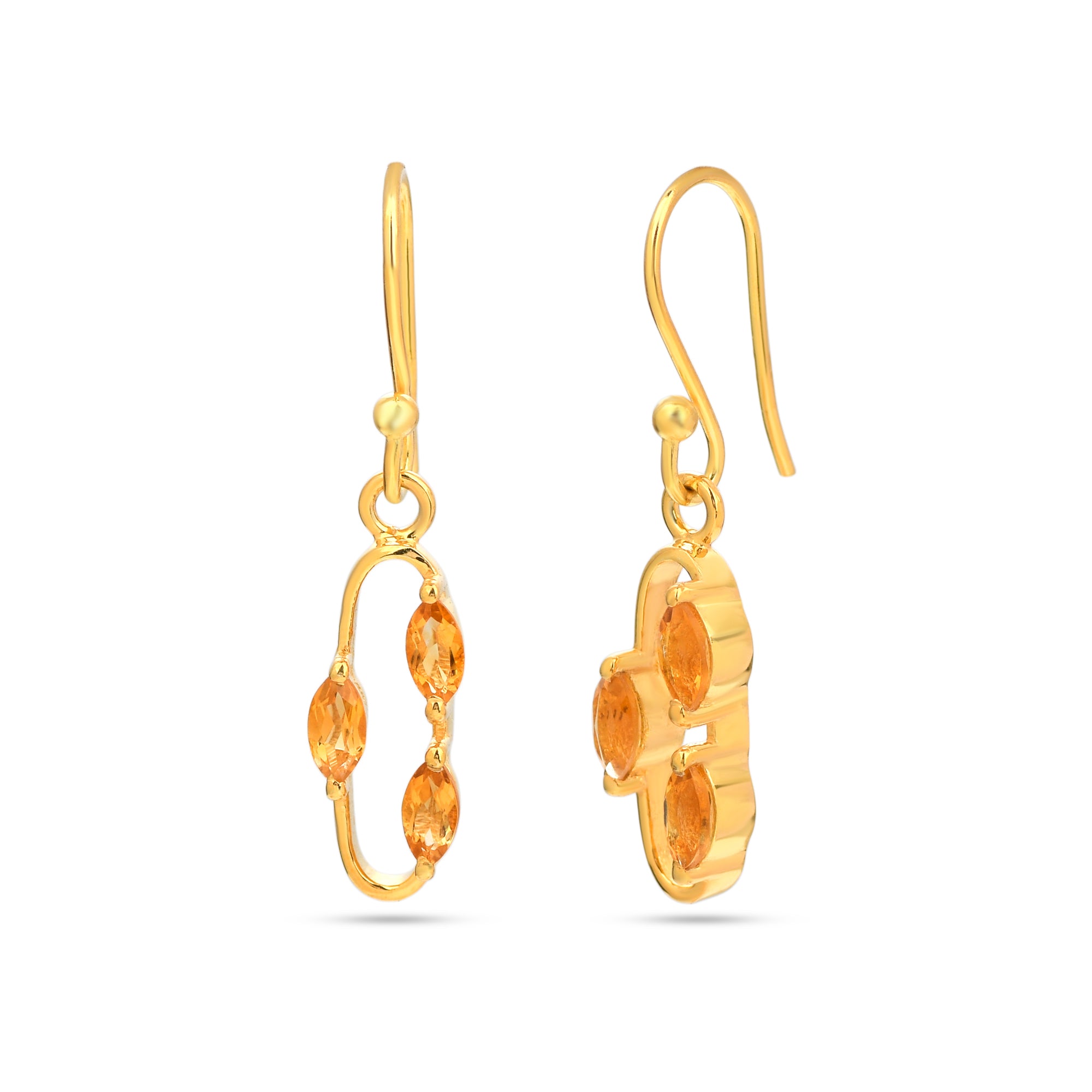 Gold earrings with orange gemstones on a white background